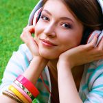 48091612 – young woman listening to the music .