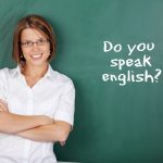 21148077 – cheerful woman teaching english class at the classroom